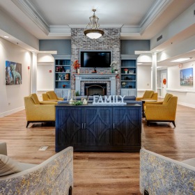 Living room with comfy sofas and a TV