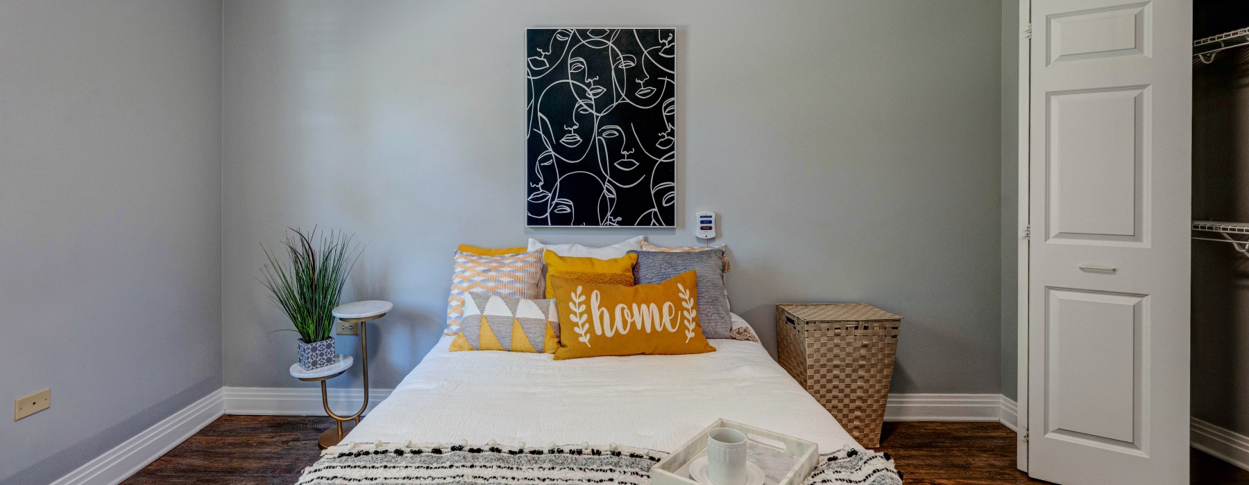 Bedroom with cozy pillows and nightstand 