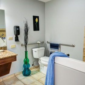 a bathroom with a tub sink and a toilet
