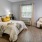 a bedroom with a bed and a chair