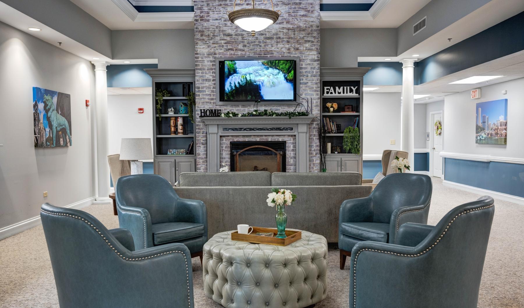 Find your perfect fit at Auberge at Lake Zurich a room with a fireplace and chairs