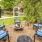 a patio with chairs and a fountain